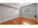 Bright bedroom with hardwood floors and a window at 958 Dunraven Dr, Winter Park, FL 32792