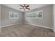 Well-lit bedroom with ceiling fan and window coverings at 958 Dunraven Dr, Winter Park, FL 32792