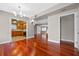 Hardwood floors and kitchen views in this bright dining room at 958 Dunraven Dr, Winter Park, FL 32792