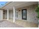 House entrance with stone facade and tiled walkway at 958 Dunraven Dr, Winter Park, FL 32792