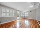 Gathering room with hardwood floors, French doors, and plantation shutters at 958 Dunraven Dr, Winter Park, FL 32792