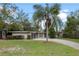 Ranch-style home with two-car garage and palm tree at 958 Dunraven Dr, Winter Park, FL 32792