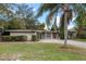 Ranch home with a two-car garage and palm tree at 958 Dunraven Dr, Winter Park, FL 32792