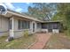 Rear house view showing screened porch and walkway at 958 Dunraven Dr, Winter Park, FL 32792