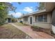 Backyard view with shed and brick pathway at 958 Dunraven Dr, Winter Park, FL 32792