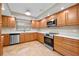 Updated kitchen featuring wood cabinets, stainless steel appliances, and quartz countertops at 958 Dunraven Dr, Winter Park, FL 32792