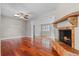 Living room with hardwood floors, fireplace, and open floor plan at 958 Dunraven Dr, Winter Park, FL 32792