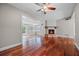 Living room features hardwood floors and a cozy fireplace at 958 Dunraven Dr, Winter Park, FL 32792