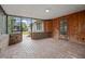 Brick-paved screened porch with backyard access at 958 Dunraven Dr, Winter Park, FL 32792