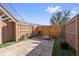 Small, fenced backyard with patio, grill, and plants at 120 Georgetown Dr, Casselberry, FL 32707