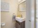 Clean and updated half bathroom with vanity, mirror, and modern fixtures at 120 Georgetown Dr, Casselberry, FL 32707
