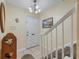Inviting entryway with staircase, wood flooring and decorative wall art at 120 Georgetown Dr, Casselberry, FL 32707