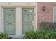 Two green doors with brick building at 120 Georgetown Dr, Casselberry, FL 32707