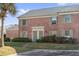 Brick building with two doors and landscaping at 120 Georgetown Dr, Casselberry, FL 32707