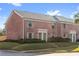 Two-unit brick building with green doors at 120 Georgetown Dr, Casselberry, FL 32707