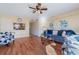 Spacious living room with hardwood floors, a ceiling fan, and access to a patio at 120 Georgetown Dr, Casselberry, FL 32707