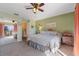 King-size bed, large mirrored closet, and access to balcony at 120 Georgetown Dr, Casselberry, FL 32707