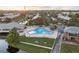 Community pool area with surrounding landscaping and patio furniture at 120 Georgetown Dr, Casselberry, FL 32707