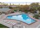 Inviting community pool with ample lounge chairs and umbrellas at 120 Georgetown Dr, Casselberry, FL 32707