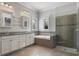Luxurious bathroom with double vanity and large shower at 13871 Briand Ave, Orlando, FL 32827