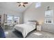 Bedroom with a workspace and window views at 13871 Briand Ave, Orlando, FL 32827