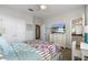 Well-lit bedroom with a dresser and en-suite bathroom at 13871 Briand Ave, Orlando, FL 32827