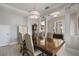 Elegant dining room with a large wood table and chandelier at 13871 Briand Ave, Orlando, FL 32827