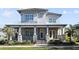 Two-story craftsman home with stone accents and metal roof at 13871 Briand Ave, Orlando, FL 32827