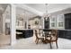 Modern kitchen with a large island, stainless steel appliances and white cabinets at 13871 Briand Ave, Orlando, FL 32827