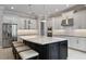 Modern kitchen with stainless steel appliances and large island at 13871 Briand Ave, Orlando, FL 32827