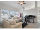 Living room with sectional sofa and workspace at 13871 Briand Ave, Orlando, FL 32827