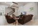 Relaxing living room with brown recliner sofas and a fireplace at 13871 Briand Ave, Orlando, FL 32827