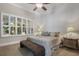 Spacious bedroom with large windows and comfortable bedding at 13871 Briand Ave, Orlando, FL 32827