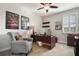 Bright home office, featuring a large desk and comfortable armchair at 13871 Briand Ave, Orlando, FL 32827