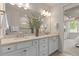 Double vanity bathroom with modern fixtures and neutral tones at 15813 Gem View St, Winter Garden, FL 34787