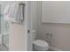 Small half bathroom with modern toilet and wall art at 15813 Gem View St, Winter Garden, FL 34787