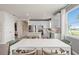 Kitchen and dining area with white table and chairs, and open floor plan at 15813 Gem View St, Winter Garden, FL 34787