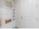 Inviting entryway with built-in bench and shelving at 15813 Gem View St, Winter Garden, FL 34787