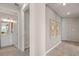 Bright hallway with access to powder room and guest room at 15813 Gem View St, Winter Garden, FL 34787