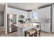 Modern kitchen featuring white cabinets, stainless steel appliances, and an island at 15813 Gem View St, Winter Garden, FL 34787