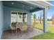 Covered patio with dining set and view of backyard at 15813 Gem View St, Winter Garden, FL 34787