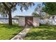 Well-maintained storage shed with brick pathway at 1593 Compass Ct, Kissimmee, FL 34744