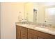 Bathroom with double vanity and granite countertop at 15959 Pantuso Aly, Winter Garden, FL 34787