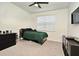 Small bedroom with a twin bed, dresser and TV at 15959 Pantuso Aly, Winter Garden, FL 34787