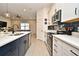 Bright kitchen with stainless steel appliances and island sink at 15959 Pantuso Aly, Winter Garden, FL 34787