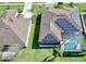 Aerial view of house with pool and solar panels installed on roof at 1855 Sugar Cove Ct, Ocoee, FL 34761