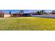 Spacious backyard featuring a lush lawn, fenced perimeter, and a view of the home's exterior at 1855 Sugar Cove Ct, Ocoee, FL 34761