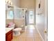Bright bathroom with a walk-in shower, toilet, vanity and tile floors at 1855 Sugar Cove Ct, Ocoee, FL 34761