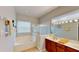 Bathroom with a separate shower and soaking tub, and double vanity at 1855 Sugar Cove Ct, Ocoee, FL 34761