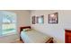 Bedroom with a cozy twin bed and a bright window at 1855 Sugar Cove Ct, Ocoee, FL 34761